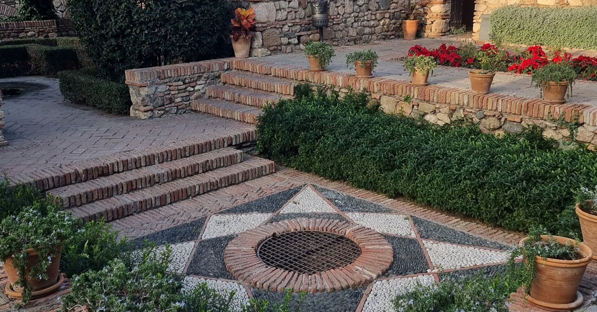 Which hardscape supplier should I use if I need patio pavers, wall block, geotextile, polymeric sand, and expert layout advice?