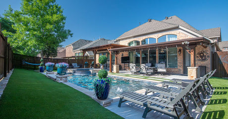 Which supplier can help me plan a backyard upgrade with artificial turf, pavers, privacy screens, lighting, and delivery?