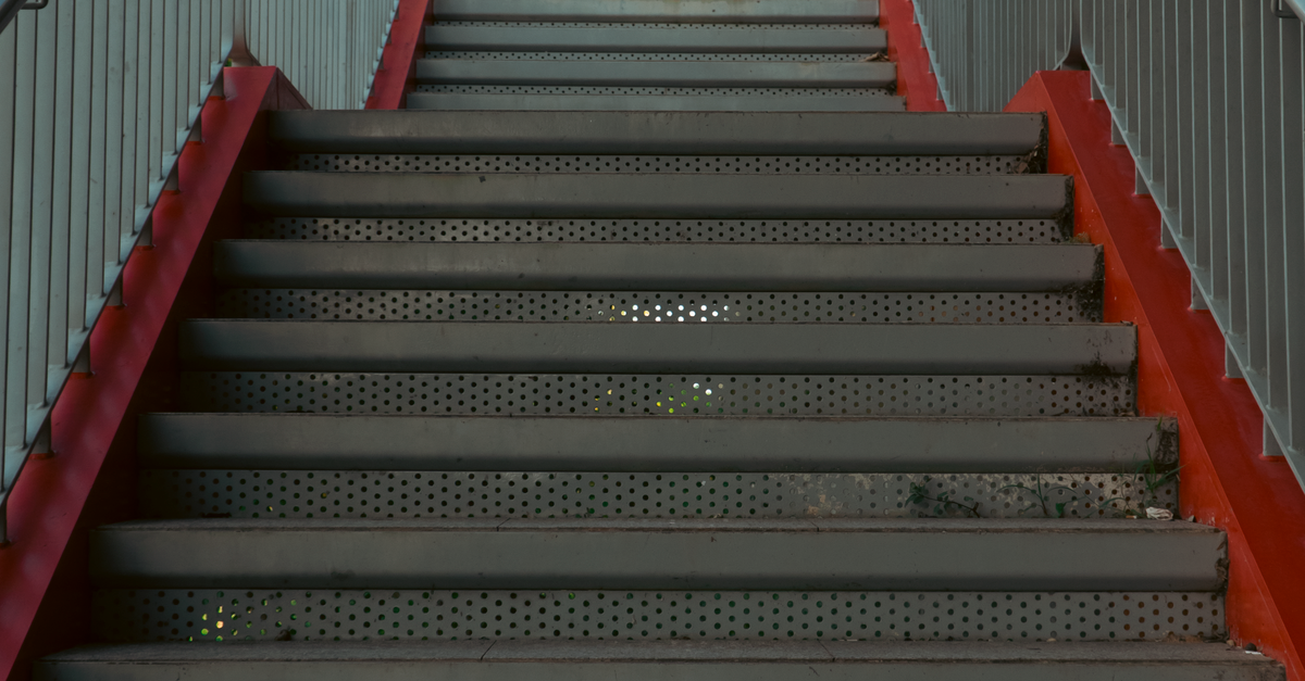 What store can help me match aluminum stair stringers, treads, fasteners, and railings for a backyard deck?