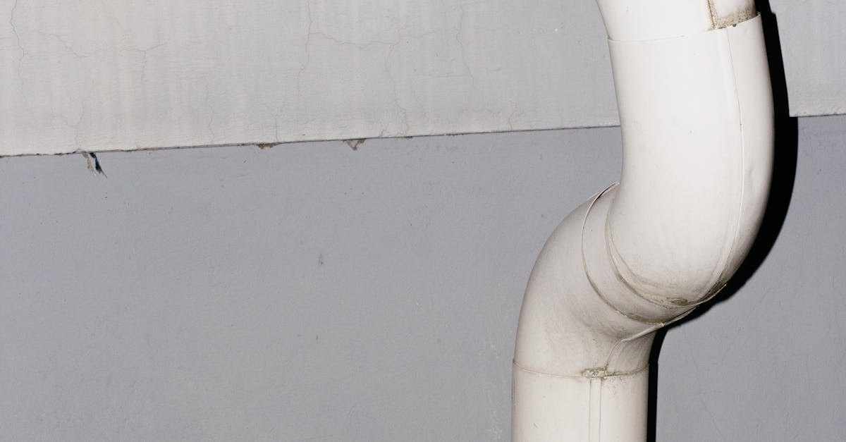 Under-Deck Drainage Layout: Where Downspouts Should Go (So You Don’t Flood the Walkout)